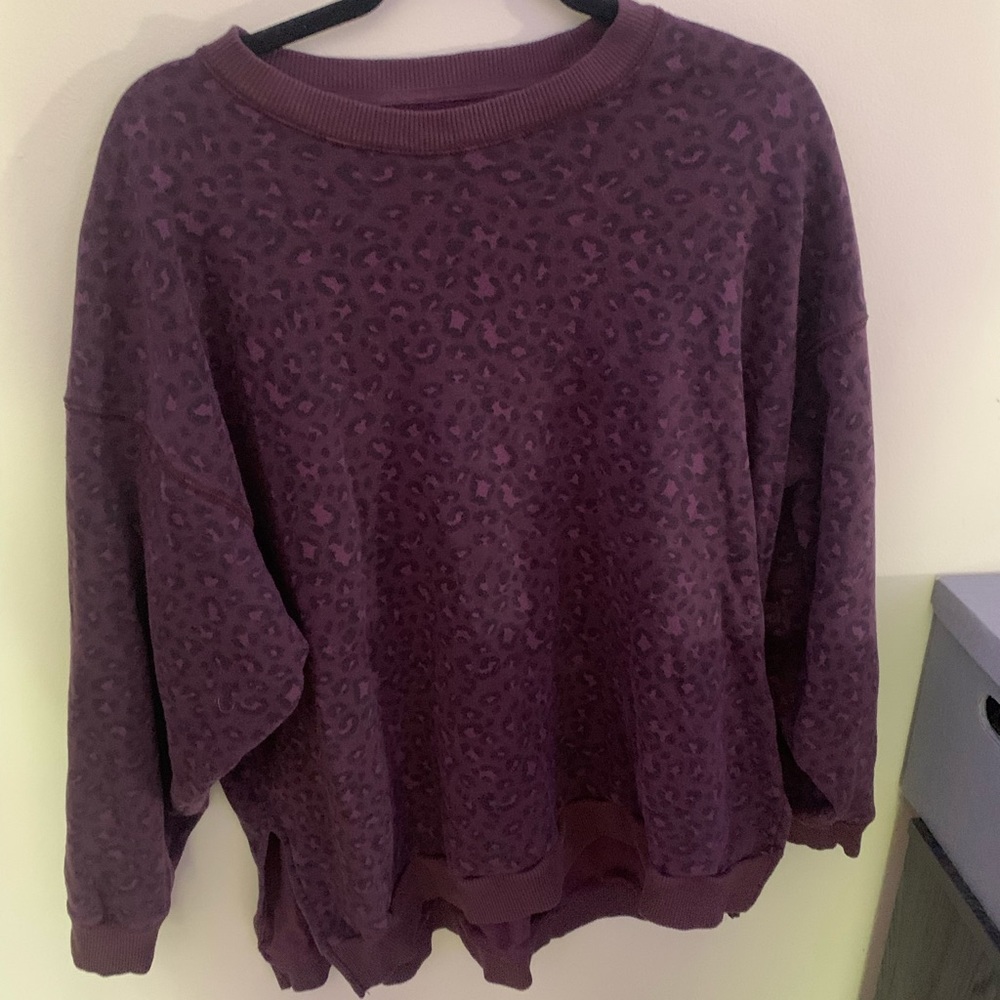 Purple and black cheetah print American eagle sweatshirt.